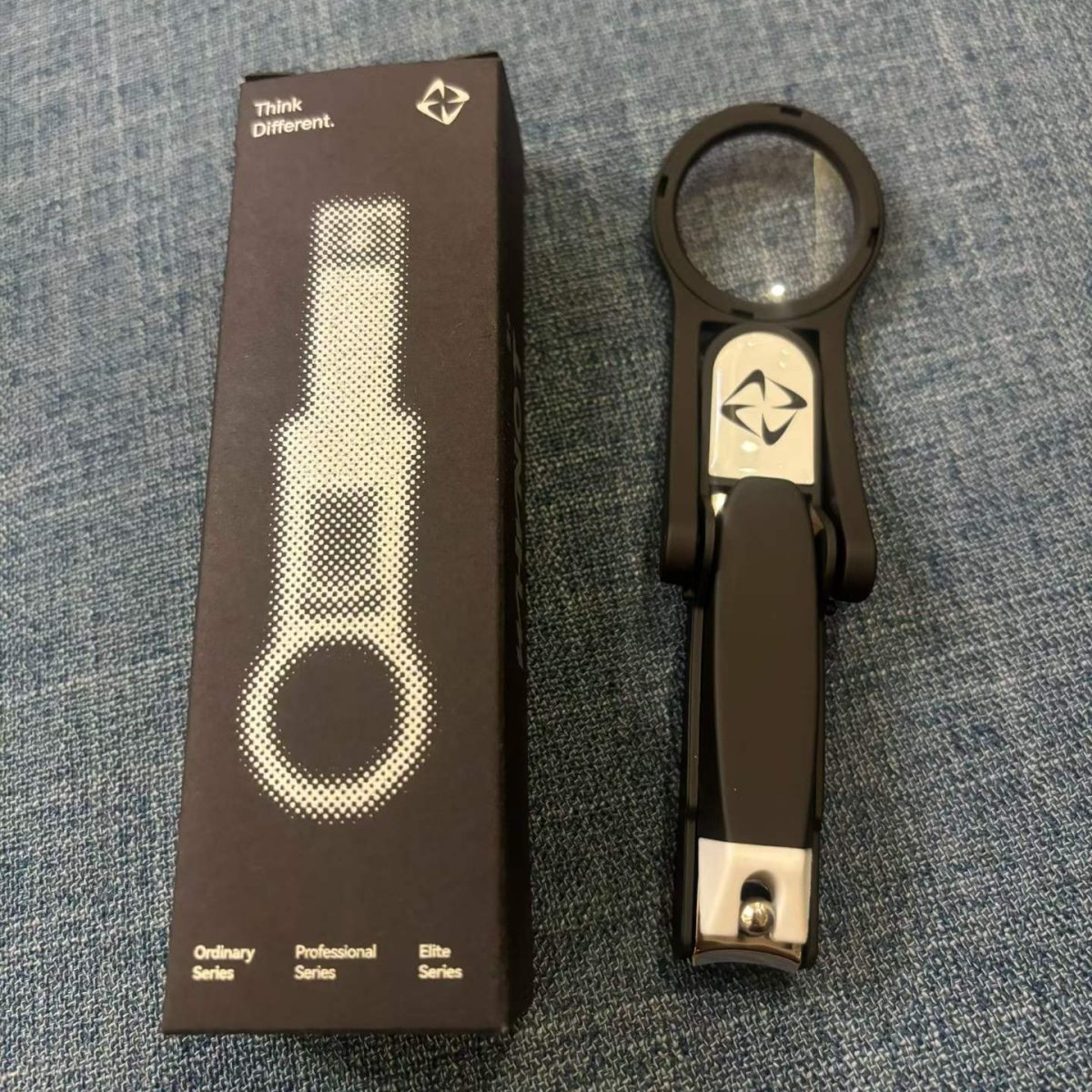 Nail clipper with magnifier